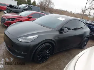 2022 Tesla Model Y Performance z VIN 7SAYGDEF4NF350696, wystawiony jako IAAI lot #41662924 z przebiegiem 36 747 mil mil oraz . Historia ofert i sprzedaży dostępna na DreamBid. Obrazek 14.