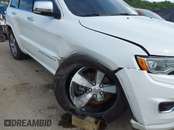 2016 Jeep Grand Cherokee Overland with VIN 1C4RJFCG2GC490420, listed as a IAAI auction lot 42200700 with 97,007 mi miles and . Bid and sale history available at DreamBid. Image 6.