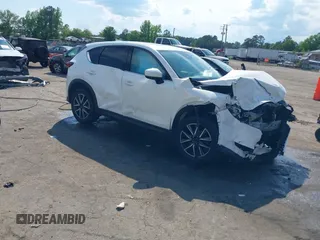 2018 Mazda CX-5 Grand Touring z VIN JM3KFBDM4J0414925, wystawiony jako IAAI lot #42212109 z przebiegiem 86 826 mil mil oraz . Historia ofert i sprzedaży dostępna na DreamBid. Obrazek 1.