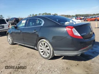 2014 Lincoln MKS z VIN 1LNHL9DK3EG606655, wystawiony jako Copart lot #42008655 z przebiegiem 100 886 mil mil oraz Szkoda całkowita • Salvage title. Historia ofert i sprzedaży dostępna na DreamBid. Obrazek 2.