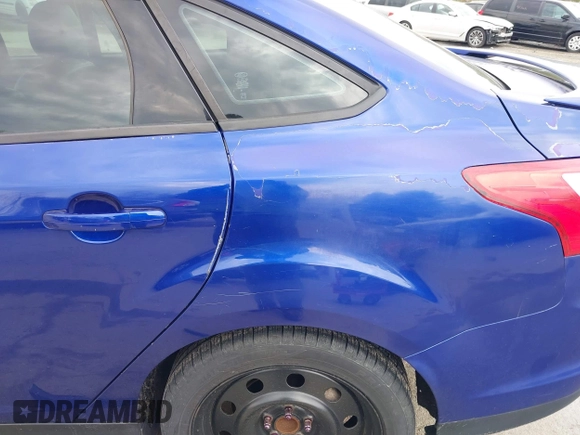 2014 Ford Focus SE with VIN 1FADP3F21EL314534, listed as a IAAI auction lot 42130032 with 103,866 mi miles. Bid and sale history available at carsss.com. Image 6.