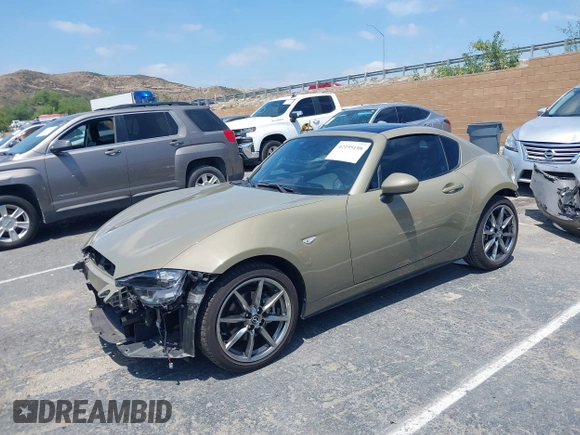 2023 Mazda MX-5 Miata Grand Touring z VIN JM1NDAM73P0561844, wystawiony jako IAAI lot #42195198 z przebiegiem 6 020 mil mil oraz . Historia ofert i sprzedaży dostępna na DreamBid. Obrazek 19.