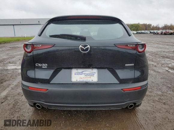 2021 Mazda CX-30 S with VIN 3MVDMBAL4MM209043, listed as a Copart auction lot 79406284 with 55,944 mi miles and Salvage title. Bid and sale history available at DreamBid. Image 6.