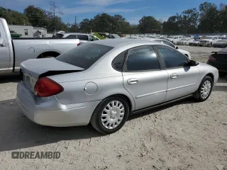 2003 Ford Taurus LX Standard z VIN 1FAFP52U43A110444, wystawiony jako Copart lot #83557764 z przebiegiem 118 897 mil mil oraz Szkoda całkowita • Salvage title. Historia ofert i sprzedaży dostępna na DreamBid. Obrazek 3.