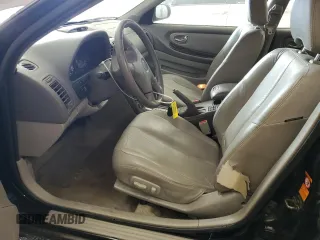 2000 Nissan Maxima GXE z VIN JN1CA31A1YT211725, wystawiony jako Copart lot #47401895 z przebiegiem 122 228 mil mil oraz Szkody całkowita. Historia ofert i sprzedaży dostępna na DreamBid. Obrazek 7.