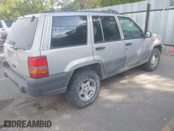 1998 Jeep Grand Cherokee Laredo with VIN 1J4GZ58S6WC319265, listed as a IAAI auction lot 42619853 with 238,667 mi miles and . Bid and sale history available at DreamBid. Image 4.