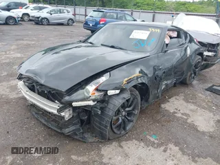 2020 Nissan 370Z Sport z VIN JN1AZ4EH6LM823399, wystawiony jako IAAI lot #42135621 z przebiegiem 98 855 mil mil oraz . Historia ofert i sprzedaży dostępna na DreamBid. Obrazek 2.