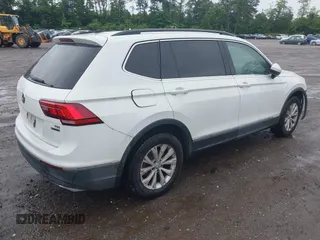 2018 Volkswagen Tiguan SEL with VIN 3VV2B7AX6JM059173, listed as a IAAI auction lot 42461175 with 86,679 mi miles and . Bid and sale history available at DreamBid. Image 4.