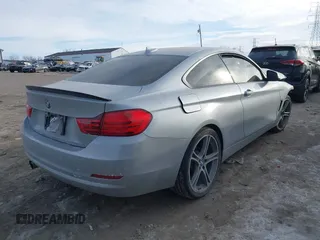 2015 BMW 4 Series 428i xDrive with VIN WBA3N9C53FK247985, listed as a IAAI auction lot 41395534 with 76,856 mi miles and . Bid and sale history available at DreamBid. Image 4.