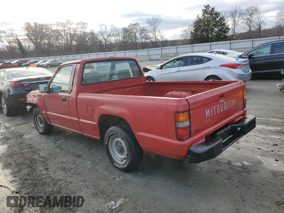 1991 Mitsubishi Mighty Max z VIN JA7FL24W3MP017705, wystawiony jako Copart lot #85737304 z przebiegiem 261 896 mil mil oraz Szkody całkowita. Historia ofert i sprzedaży dostępna na DreamBid. Obrazek 2.