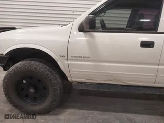 1998 Isuzu Rodeo S with VIN 4S2CM58W8W4363868, listed as a IAAI auction lot 42073264 with 204,885 mi miles. Bid and sale history available at carsss.com. Image 6.