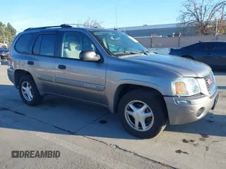 2005 GMC Envoy SLT with VIN 1GKDT13S152373799, listed as a IAAI auction lot 41537512 with 187,750 mi miles. Bid and sale history available at carsss.com. Image 1.