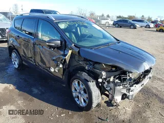 2016 Ford Escape Titanium z VIN 1FMCU9J91GUA72102, wystawiony jako IAAI lot #41641812 z przebiegiem 166 688 mil mil oraz . Historia ofert i sprzedaży dostępna na DreamBid. Obrazek 1.