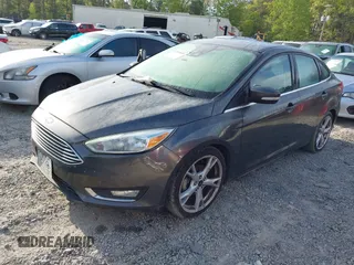 2016 Ford Focus Titanium with VIN 1FADP3J25GL282293, listed as a IAAI auction lot 41998959 with 119,781 mi miles and . Bid and sale history available at DreamBid. Image 2.