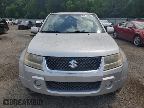 2006 Suzuki Grand Vitara z VIN JS3TE941764101657, wystawiony jako Copart lot #54943205 z przebiegiem 206 744 mil mil oraz Szkody całkowita. Historia ofert i sprzedaży dostępna na DreamBid. Obrazek 5.