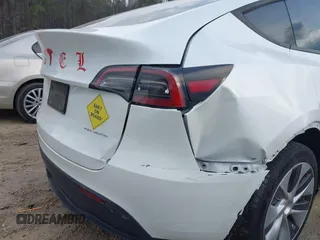2023 Tesla Model Y Long Range with VIN 7SAYGDEE2PF765395, listed as a IAAI auction lot 41688080 with 27,792 mi miles and . Bid and sale history available at DreamBid. Image 23.