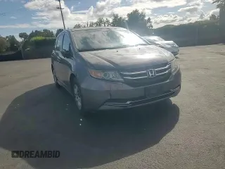 2015 Honda Odyssey LX with VIN 5FNRL5H27FB018491, listed as a Copart auction lot 54888445 with 129,488 mi miles and Salvage Title. Bid and sale history available at DreamBid. Image 14.