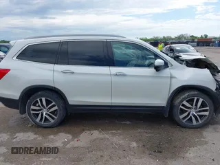 2017 Honda Pilot Touring with VIN 5FNYF6H9XHB034001, listed as a IAAI auction lot 42092549 with 142,422 mi miles and . Bid and sale history available at DreamBid. Image 13.