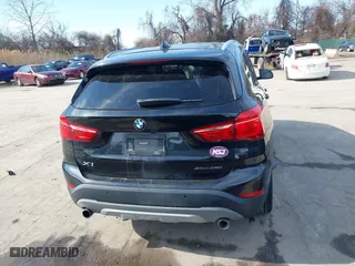 2019 BMW X1 xDrive28i with VIN WBXHT3C51K5L89758, listed as a IAAI auction lot 41535652 with 96,612 mi miles. Bid and sale history available at carsss.com. Image 16.