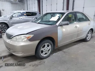 2004 Toyota Camry LE with VIN 4T1BE32K24U852256, listed as a IAAI auction lot 42036477 with 154,389 mi miles. Bid and sale history available at carsss.com. Image 2.
