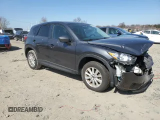 2014 Mazda CX-5 Touring with VIN JM3KE2CY0E0322059, listed as a Copart auction lot 48091805 with 212,889 mi miles and Salvage Title. Bid and sale history available at carsss.com. Image 4.