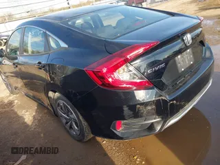 2020 Honda Civic LX with VIN 19XFC2F68LE029699, listed as a IAAI auction lot 41894102 with 113,900 mi miles and . Bid and sale history available at DreamBid. Image 3.