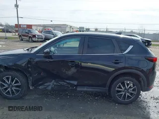 2018 Mazda CX-5 Touring with VIN JM3KFBCMXJ0438177, listed as a IAAI auction lot 42152275 with 65,434 mi miles and . Bid and sale history available at carsss.com. Image 14.