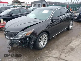 2014 Lincoln MKS with VIN 1LNHL9EK7EG609329, listed as a IAAI auction lot 41555819 with 89,849 mi miles. Bid and sale history available at carsss.com. Image 2.