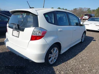 2009 Honda Fit Sport w/Navi with VIN JHMGE88609C002848, listed as a IAAI auction lot 42121403 with 168,138 mi miles. Bid and sale history available at carsss.com. Image 4.