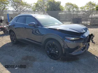 2023 Mazda CX-30 S Premium with VIN 3MVDMBDM7PM543849, listed as a Copart auction lot 54852415 with 20,898 mi miles and Salvage title. Bid and sale history available at DreamBid. Image 4.