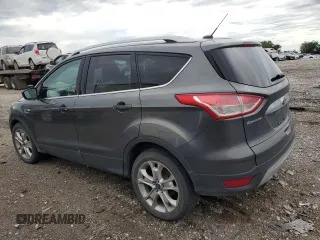 2015 Ford Escape Titanium with VIN 1FMCU9J96FUB32972, listed as a Copart auction lot 62886145 with 215,769 mi miles and Salvage title. Bid and sale history available at DreamBid. Image 2.