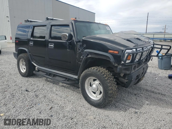 2004 Hummer H2 z VIN 5GRGN23U74H100175, wystawiony jako Copart lot #52642125 z przebiegiem 112 305 mil mil oraz Szkoda całkowita • Salvage title. Historia ofert i sprzedaży dostępna na DreamBid. Obrazek 4.