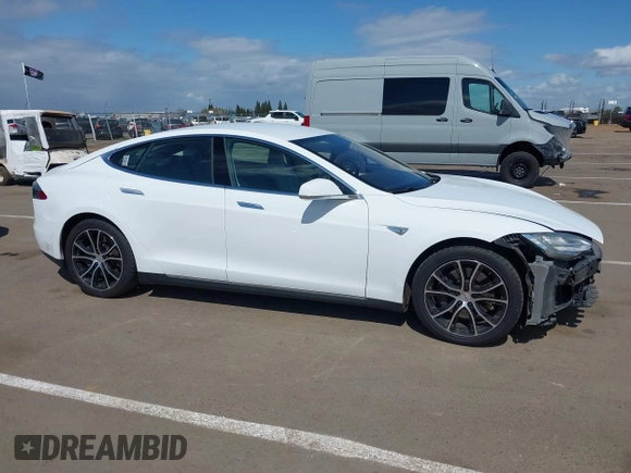 2014 Tesla Model S 60 with VIN 5YJSA1H10EFP56526, listed as a IAAI auction lot 41871784 with 143,361 mi miles and . Bid and sale history available at DreamBid. Image 14.
