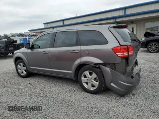 2013 Dodge Journey American Value with VIN 3C4PDCAB7DT500878, listed as a Copart auction lot 58397655 with 183,755 mi miles and Salvage title. Bid and sale history available at DreamBid. Image 2.
