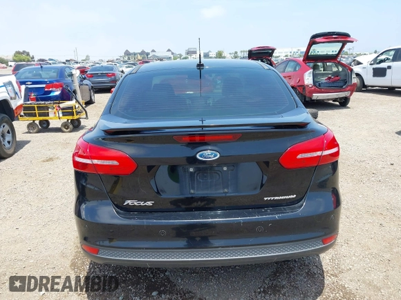 2016 Ford Focus Titanium z VIN 1FADP3J20GL310467, wystawiony jako IAAI lot #42478332 z przebiegiem 214 479 mil mil oraz . Historia ofert i sprzedaży dostępna na DreamBid. Obrazek 16.