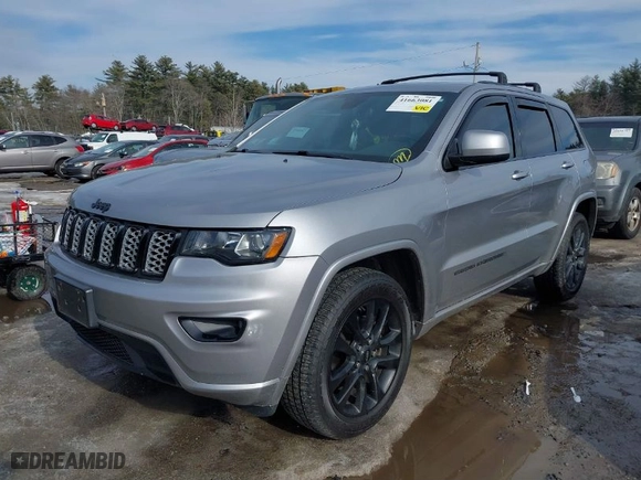 2018 Jeep Grand Cherokee Laredo E with VIN 1C4RJFAG1JC487082, listed as a IAAI auction lot 41663081 with 136,853 mi miles. Bid and sale history available at carsss.com. Image 2.