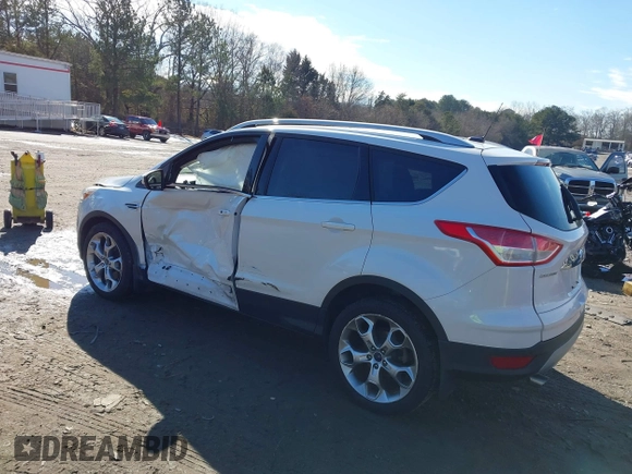 2014 Ford Escape Titanium with VIN 1FMCU9JX7EUD17335, listed as a IAAI auction lot 41302107 with 104,352 mi miles and . Bid and sale history available at DreamBid. Image 3.