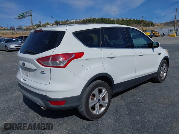 2014 Ford Escape SE with VIN 1FMCU9GX0EUD05633, listed as a IAAI auction lot 41582757 with 103,729 mi miles. Bid and sale history available at carsss.com. Image 4.