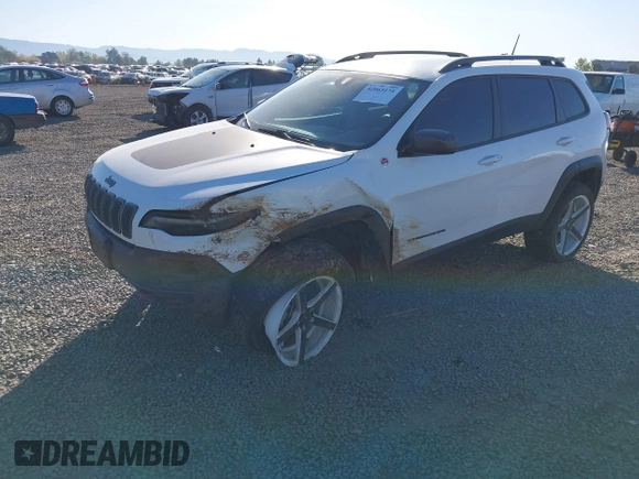 2021 Jeep Cherokee Trailhawk with VIN 1C4PJMBX9MD105888, listed as a IAAI auction lot 42065175 with 55,469 mi miles and . Bid and sale history available at DreamBid. Image 2.