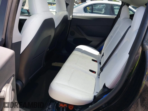 2024 Tesla Model Y with VIN 7SAYGDED9RF191453, listed as a IAAI auction lot 42272051 with 7,805 mi miles and . Bid and sale history available at DreamBid. Image 8.