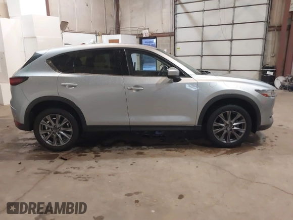 2021 Mazda CX-5 Grand Touring with VIN JM3KFADMXM1318015, listed as a IAAI auction lot 41221528 with 79,473 mi miles. Bid and sale history available at carsss.com. Image 13.