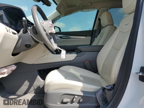 2023 Cadillac XT5 FWD Premium Luxury with VIN 1GYKNCRS7PZ150378, listed as a Copart auction lot 71792184 with 21,631 mi miles and Salvage Title. Bid and sale history available at carsss.com. Image 7.