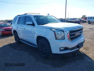 2016 GMC Yukon SLT with VIN 1GKS1BKC5GR249901, listed as a IAAI auction lot 41233673 with 75,118 mi miles. Bid and sale history available at carsss.com. Image 1.