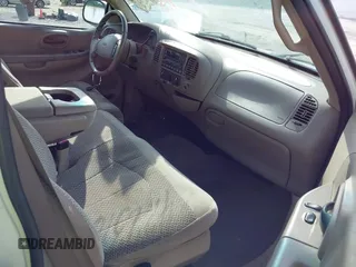 2001 Ford F-150 XL z VIN 1FTRX17WX1NA20036, wystawiony jako IAAI lot #42231600 z przebiegiem 181 549 mil mil oraz . Historia ofert i sprzedaży dostępna na DreamBid. Obrazek 5.