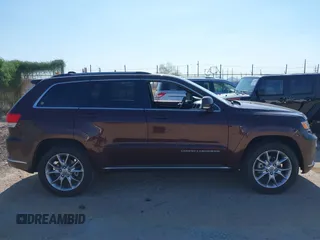 2015 Jeep Grand Cherokee Summit with VIN 1C4RJFJGXFC125131, listed as a IAAI auction lot 42475017 with 128,166 mi miles and . Bid and sale history available at DreamBid. Image 13.