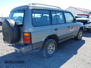 1993 Mitsubishi Montero z VIN JA4MR41H4PJ007602, wystawiony jako IAAI lot #41832401 z przebiegiem 191 549 mil mil oraz . Historia ofert i sprzedaży dostępna na DreamBid. Obrazek 4.