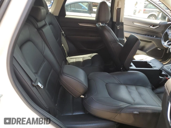 2018 Mazda CX-5 Grand Touring z VIN JM3KFBDM1J0473754, wystawiony jako Copart lot #60362245 z przebiegiem 72 792 mil mil oraz Szkoda całkowita • Salvage title. Historia ofert i sprzedaży dostępna na DreamBid. Obrazek 11.