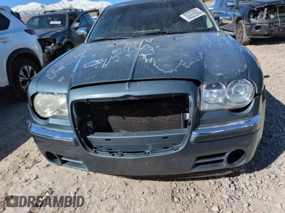 2005 Chrysler 300 with VIN 2C3AA63H35H659798, listed as a Copart auction lot 50322065 with 153,944 mi miles and Salvage Title. Bid and sale history available at carsss.com. Image 5.