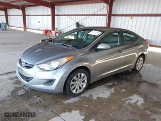 2012 Hyundai Elantra GLS PZEV with VIN KMHDH4AE5CU235756, listed as a IAAI auction lot 41312506 with 118,621 mi miles. Bid and sale history available at carsss.com. Image 2.