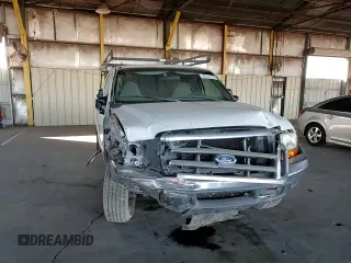1999 Ford F-250 XL with VIN 1FTNX20FXXEE59499, listed as a Copart auction lot 87511735 with 215,520 mi miles and Salvage title. Bid and sale history available at DreamBid. Image 10.